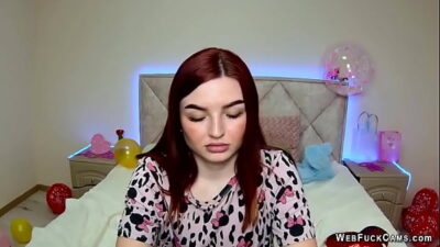 Redhead amateur babe strips pajamas and shows tattoo on webcam